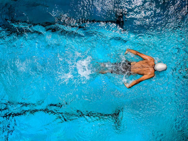 overhead-of-a-person-swimming-in-a-pool